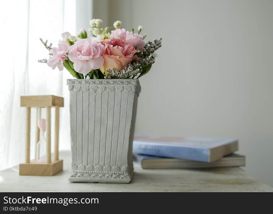 Carnation Flower In Cement Pot On Vintage Cabinet At The Bedroom