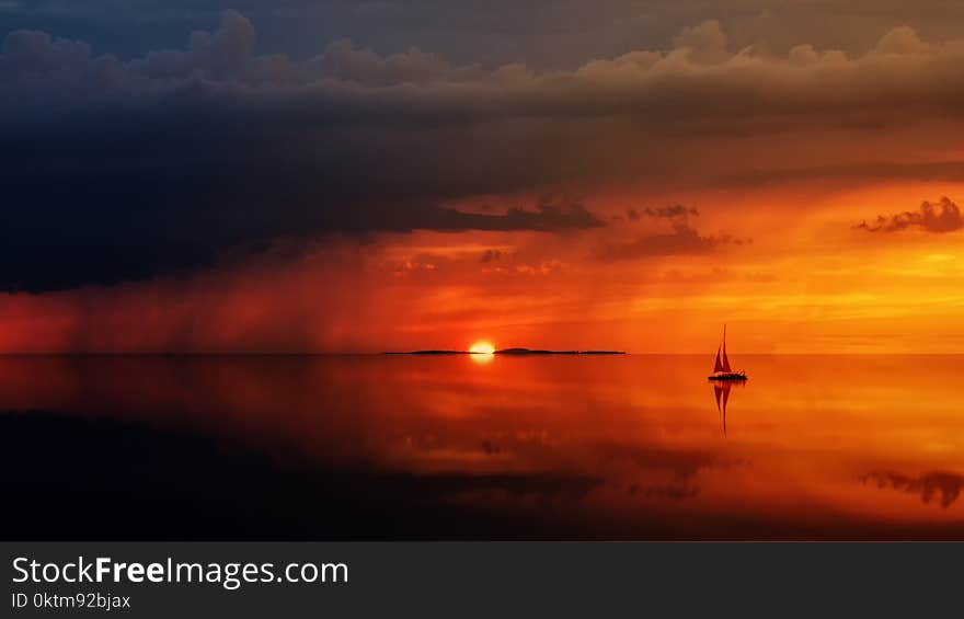 Sailboat On Body Of Water At Daytime