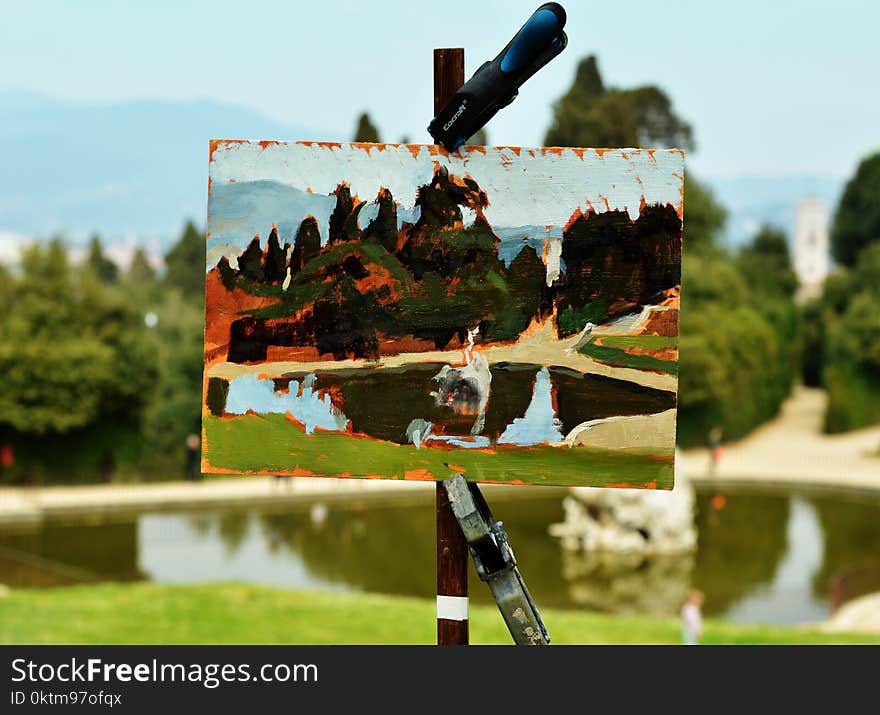 Painting of Body of Water on Front of the Model during Day