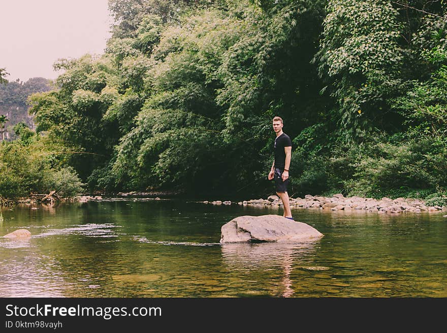 Man Standing On Rock