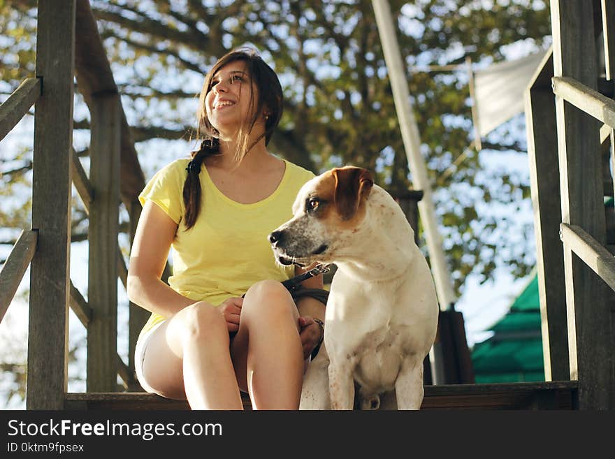 Woman Sitting Near the Jack Russell Terrier