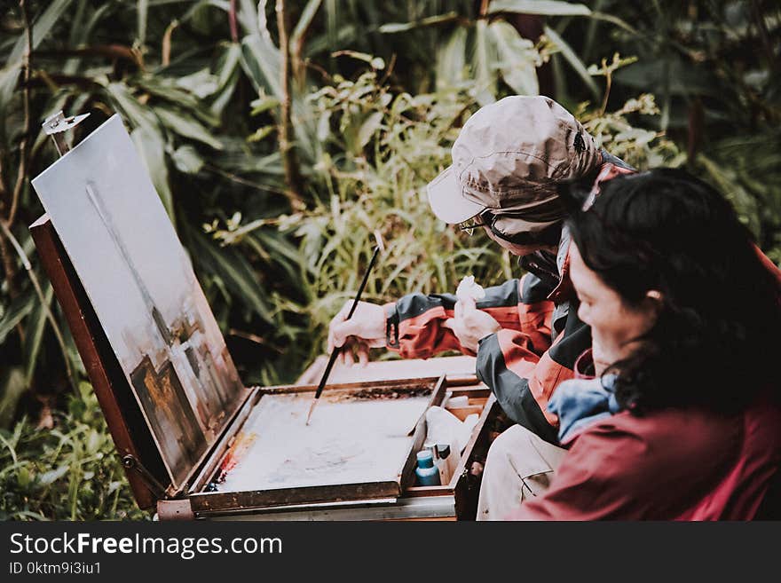 Two Persons Painting Artwork