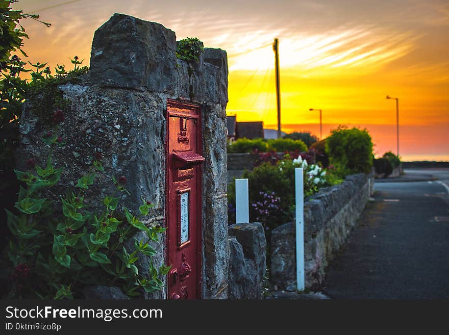 Gray Concrete Wall With Red Metal Door