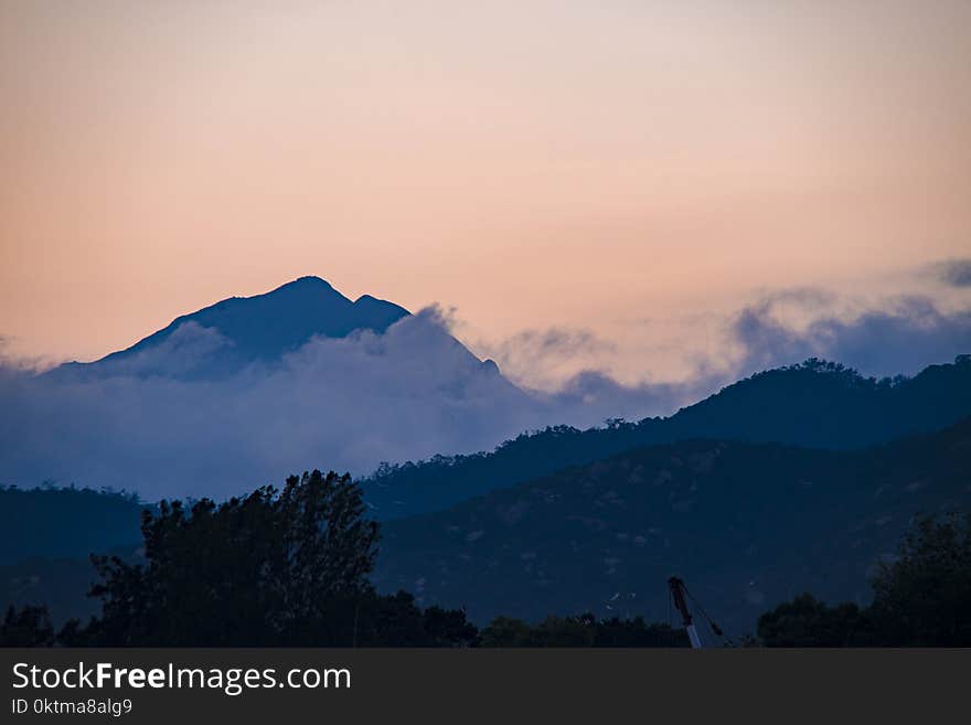 Silhouette Of Mountain During Sunset