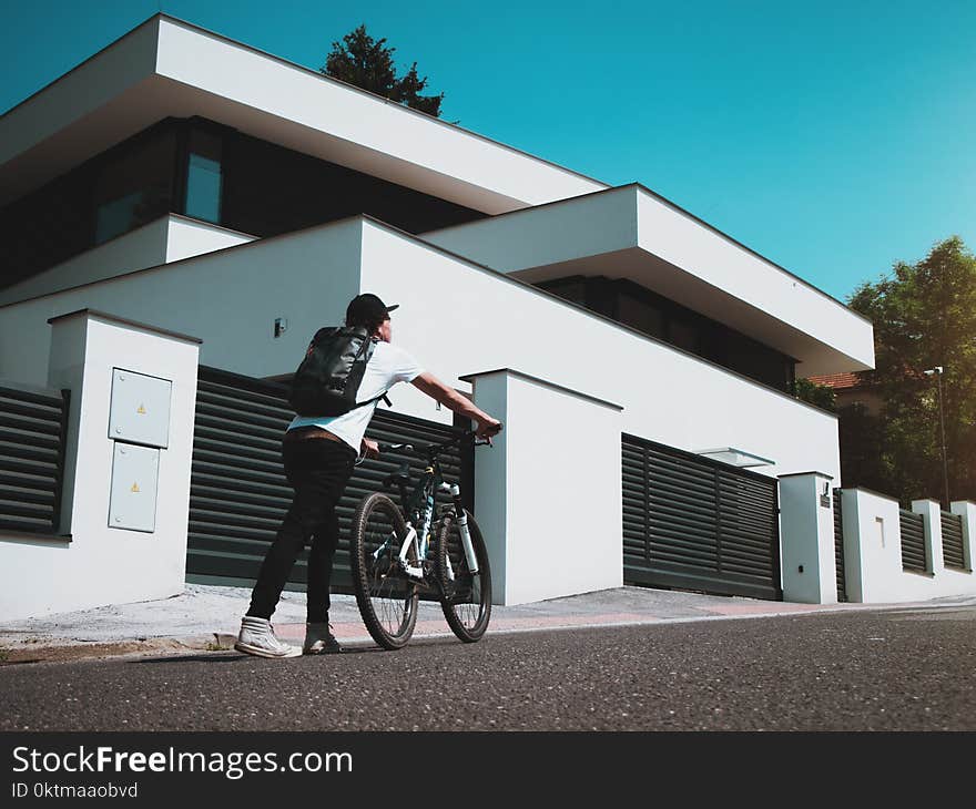 Man Holding Bike