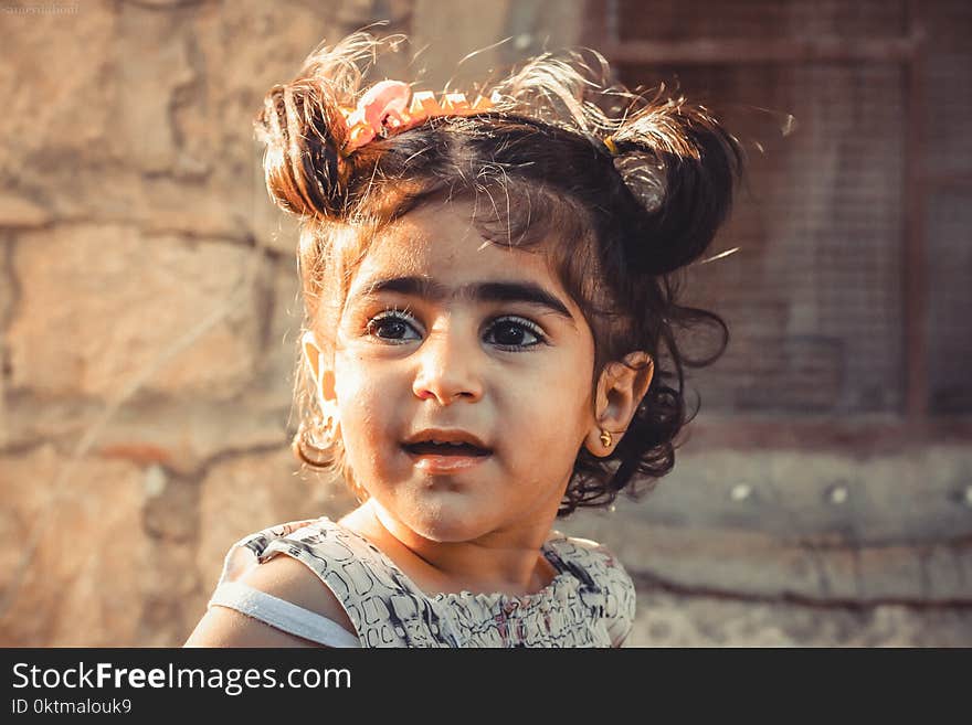 Shallow Focus Photography of Child in Gray Top