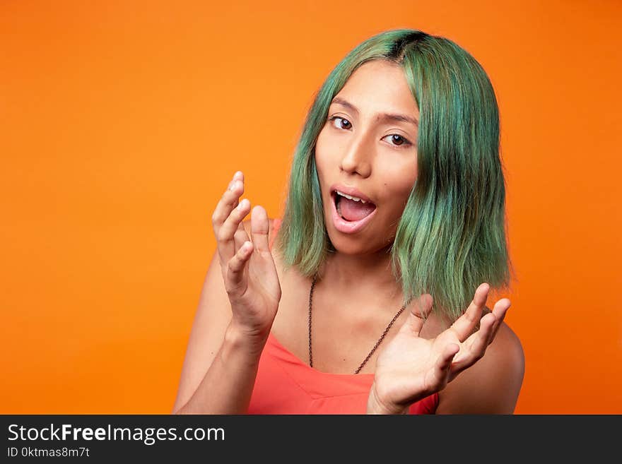 Woman Wearing Orange Spaghetti Strap Top