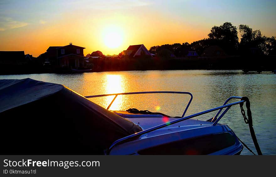 Boat on Body of Water during Golden Hour