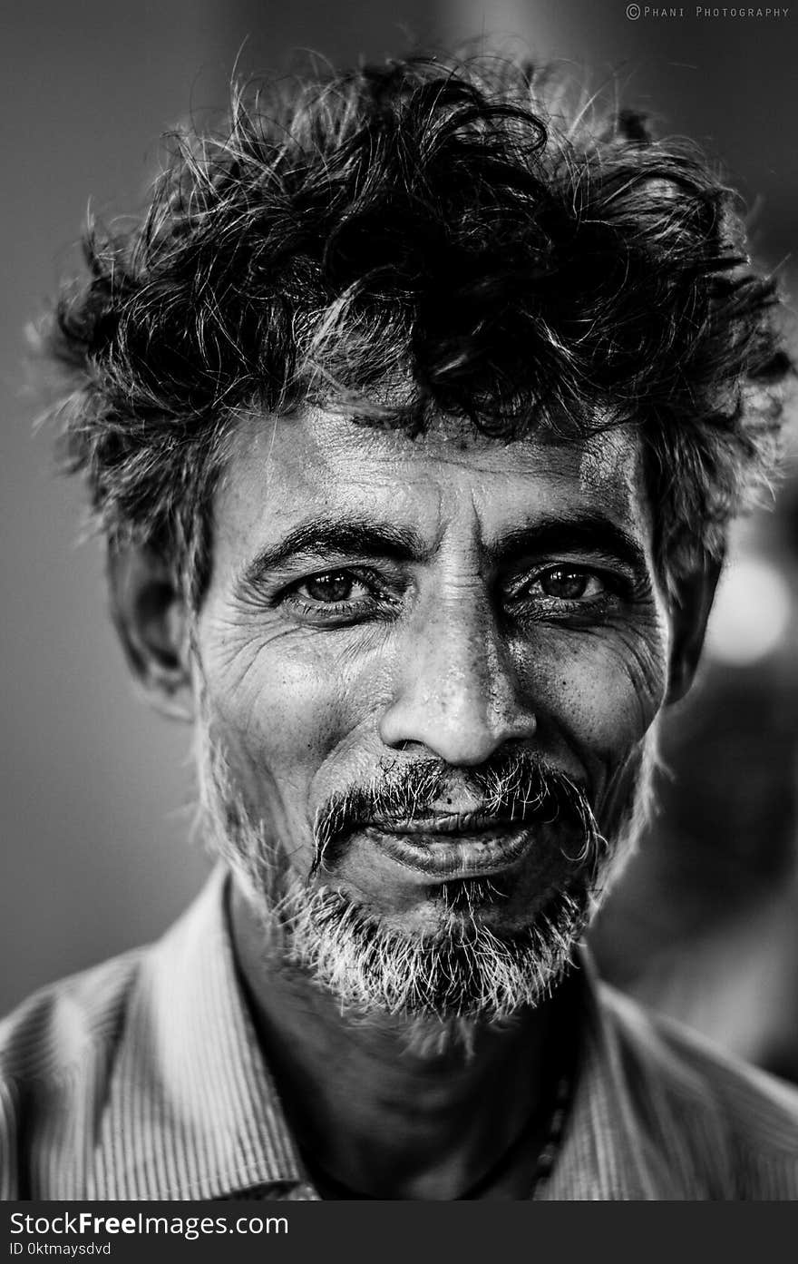 Grayscale Photo of Smiling Man