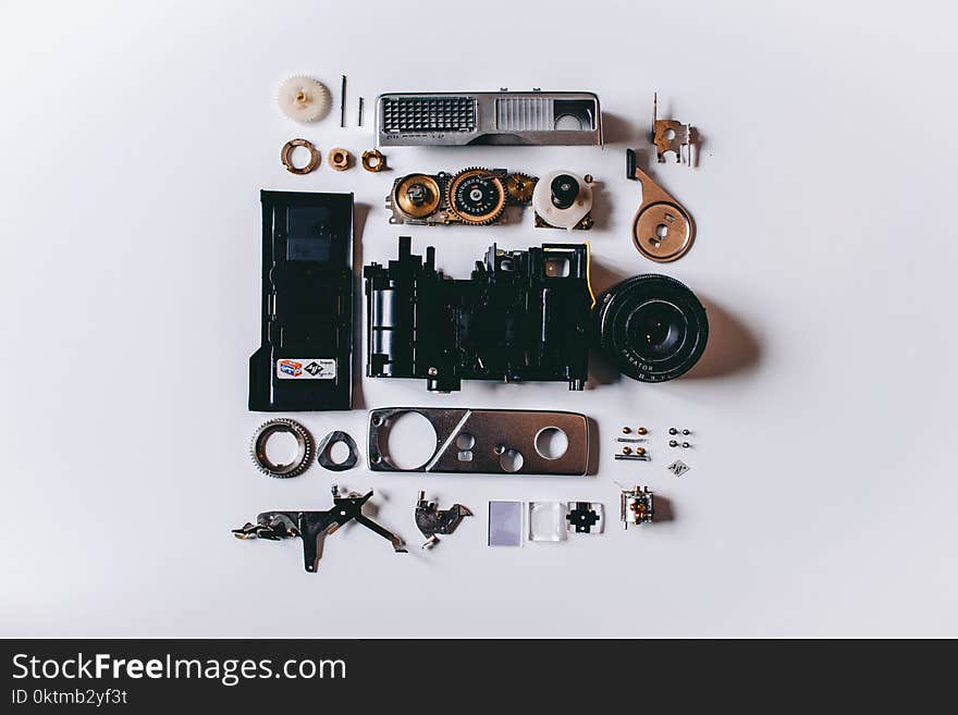 Flat Lay Photography of Black and Gray Components on White Surface