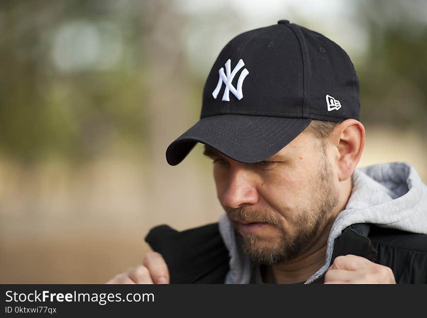 Man Wearing New York Yankees Cap