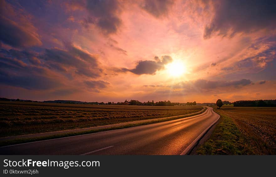 Asphalt Road during Sunset