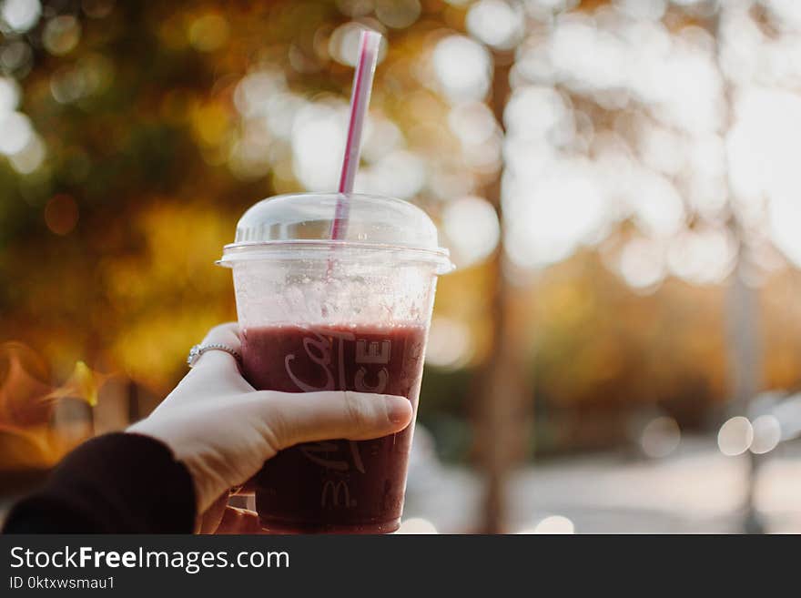 Person Holding Plastic Cup