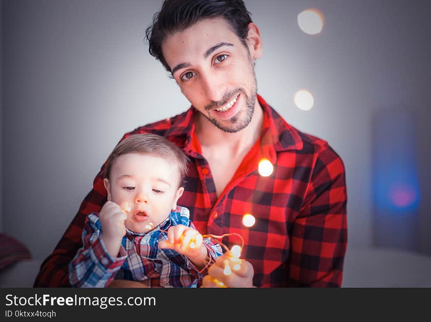 Man Carrying Toddler