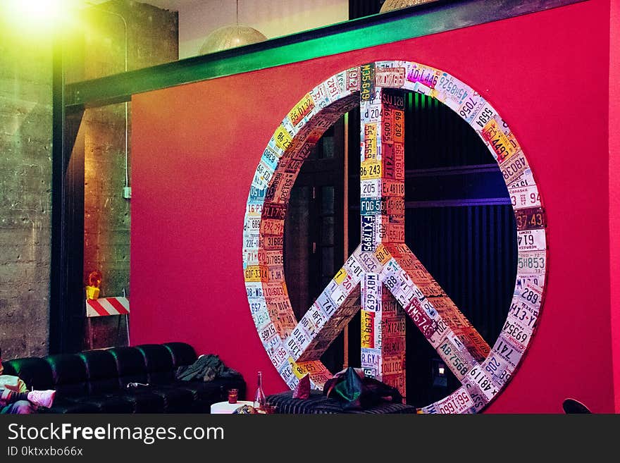 Red and Multicolored License Plate Covered Peace Sign Wall Decor