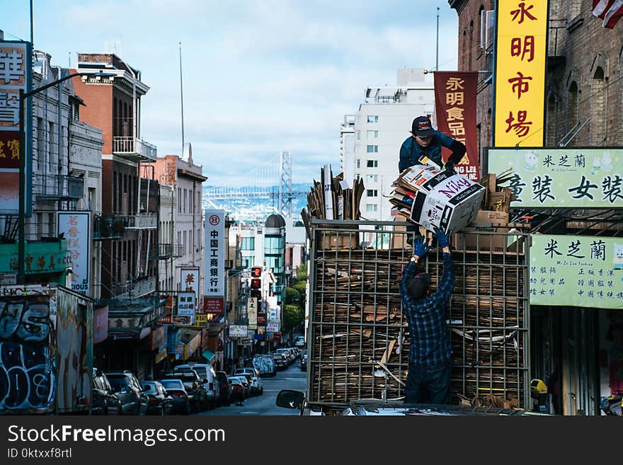 Man Carrying White Box