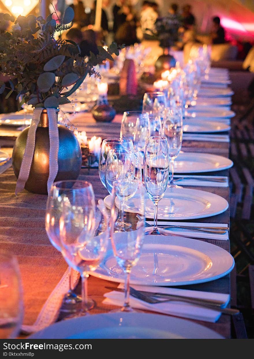 Plates and Wine Glass on Table