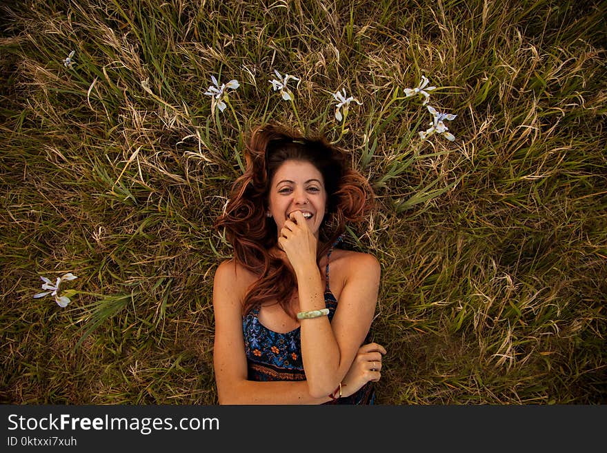 Woman Wearing Blue and Multicolored Floral Cami Top