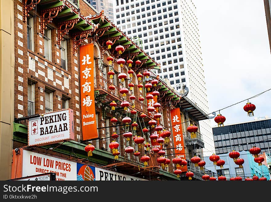 Red Chinese Paper Lanterns Hanged Near Buildings