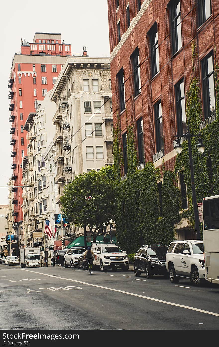 Cars Parked Near Buildings at Daytime