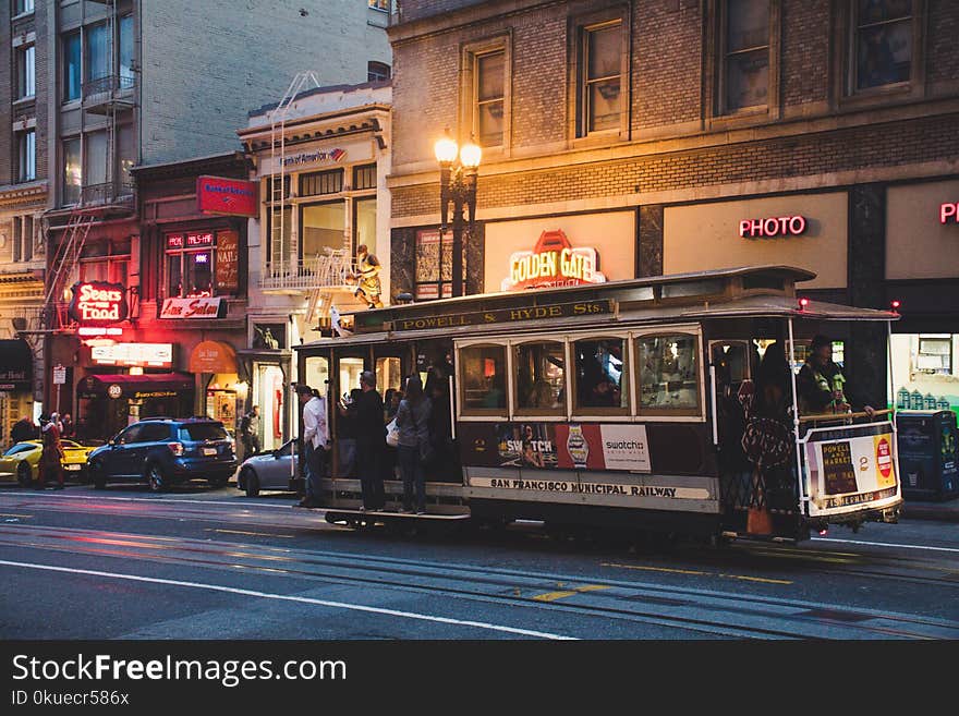 Gray and Black Tram during Night Time