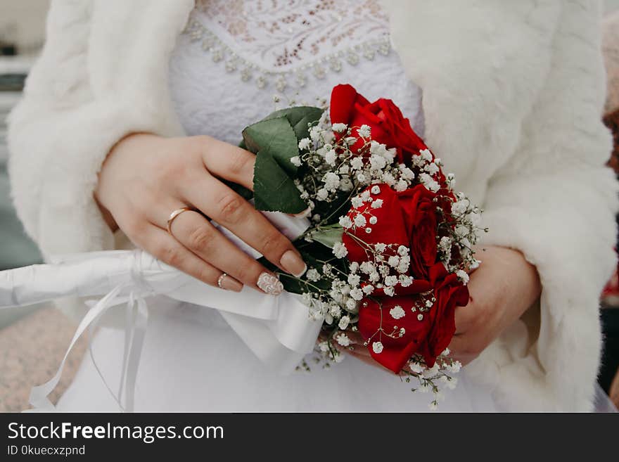 Woman Holding Red Rose Bouquet