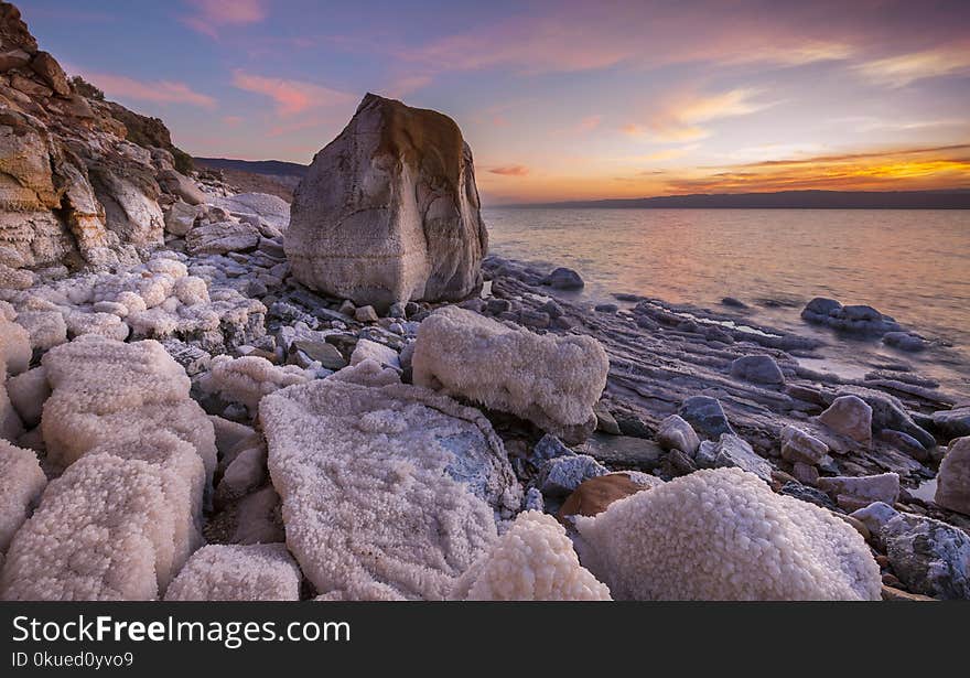 Gray Rock Formation on Seaside at Golden Hour