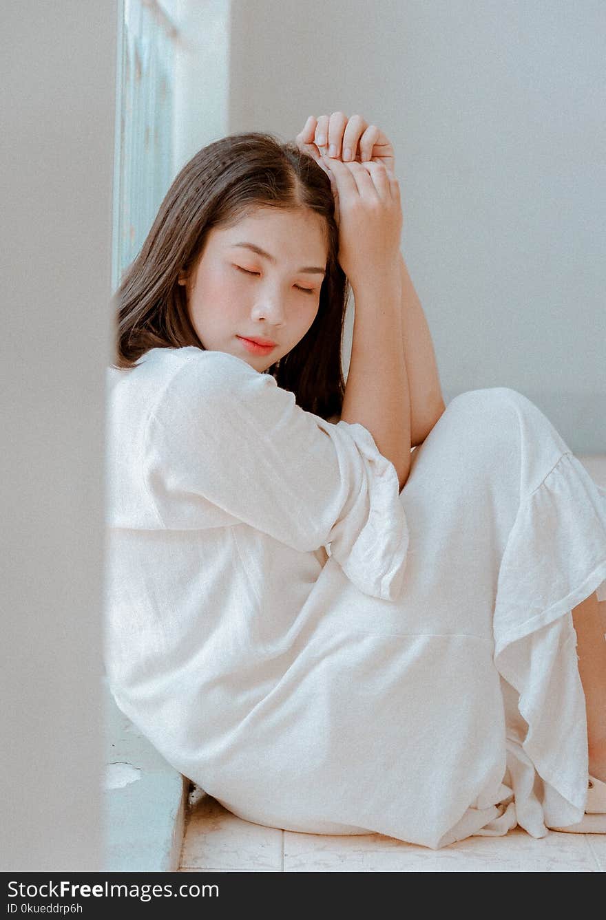 Woman Sitting Wearing White Dress