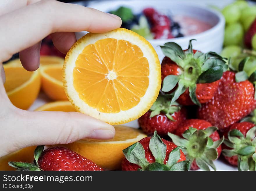 Slice Orange Fruit and Strawberries