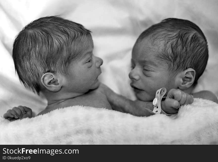 Grayscale Photography of Two Newborn