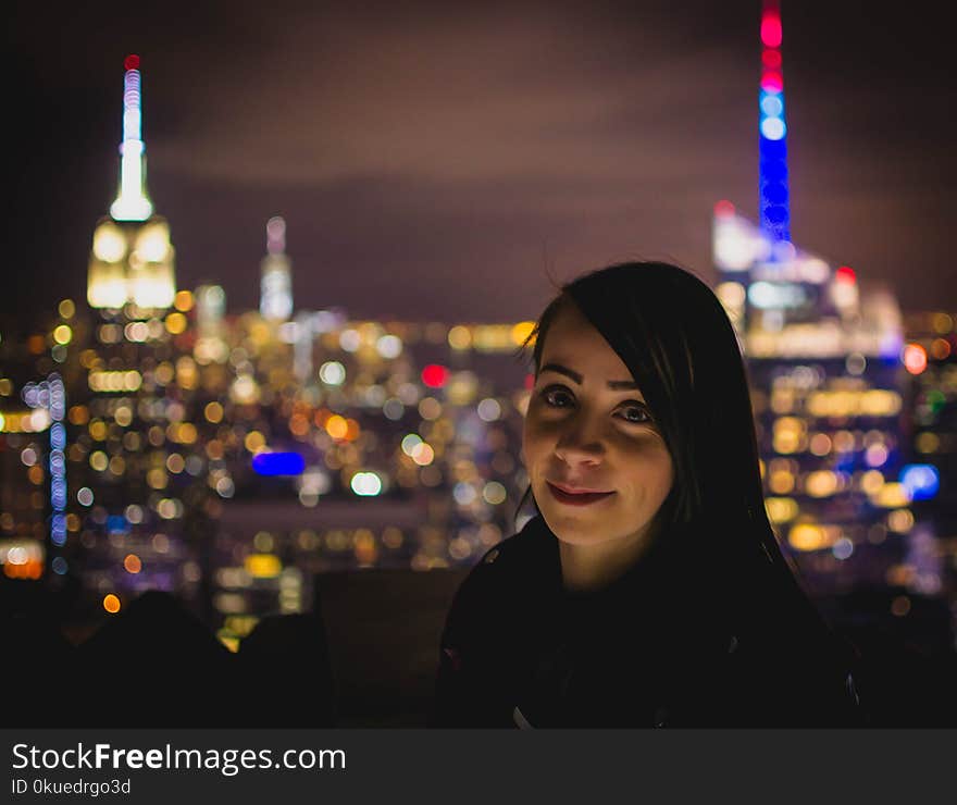 Bokeh Photograph of Woman during Nighttime