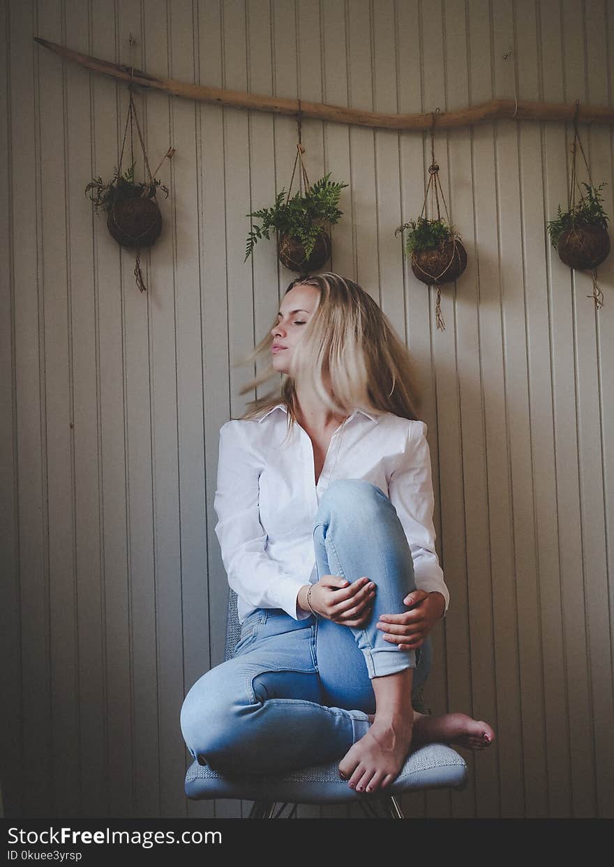 Photo of Woman Sitting on Chair