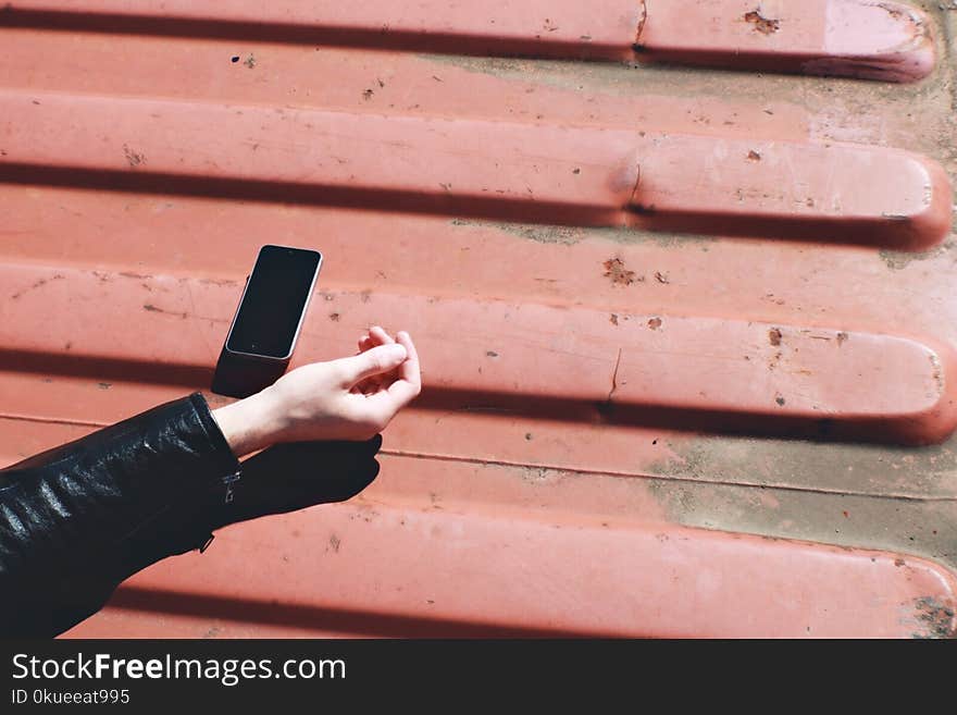 Black Smartphone Near Human Hand