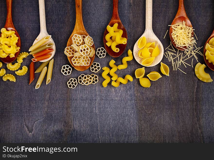 Different pasta in spoons