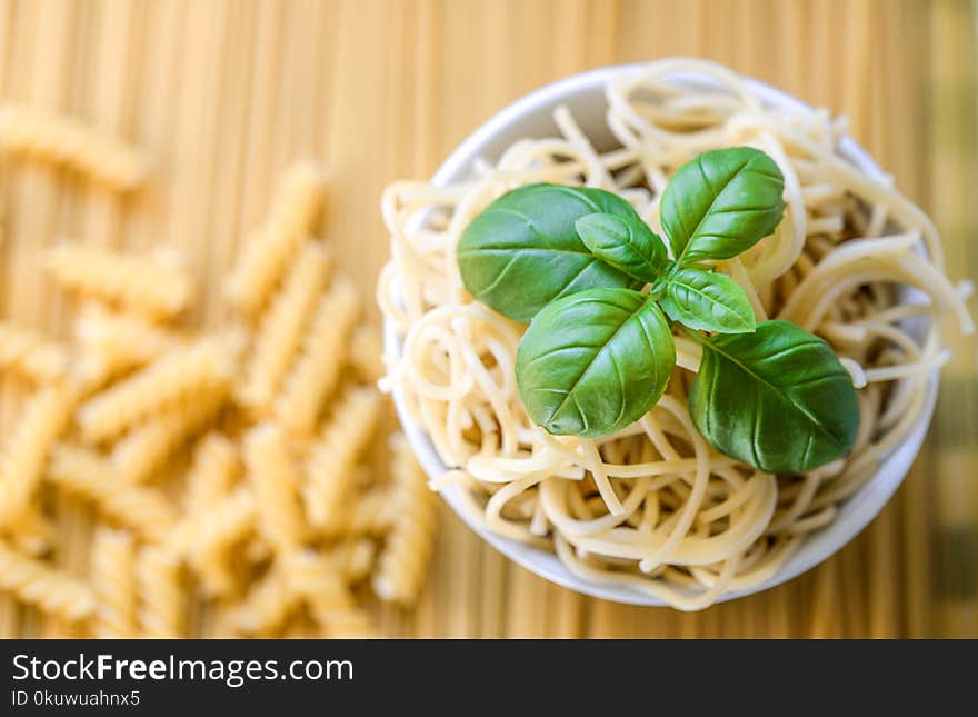 Pasta Noodles With Fresh Basil Leaves