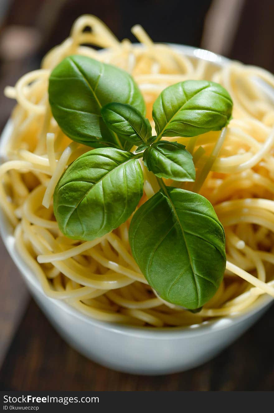 Green Basil Leaves on Top of Pasta