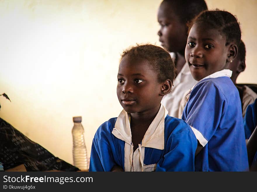 Three Children Wearing School Uniforms