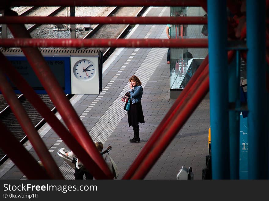 Woman Standing Near Rail Road