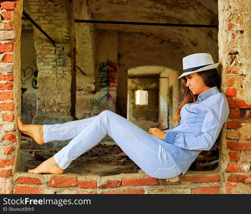 Woman in Blue Chambray Shirt and Blue Denim Jeans Posing for a Photo