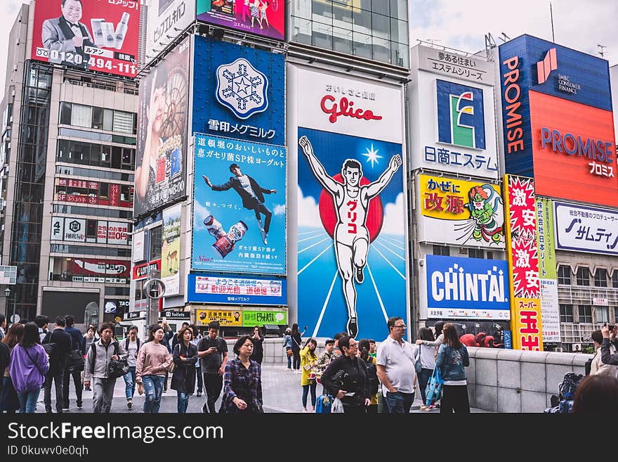 People Walks Near Electronic Billboards