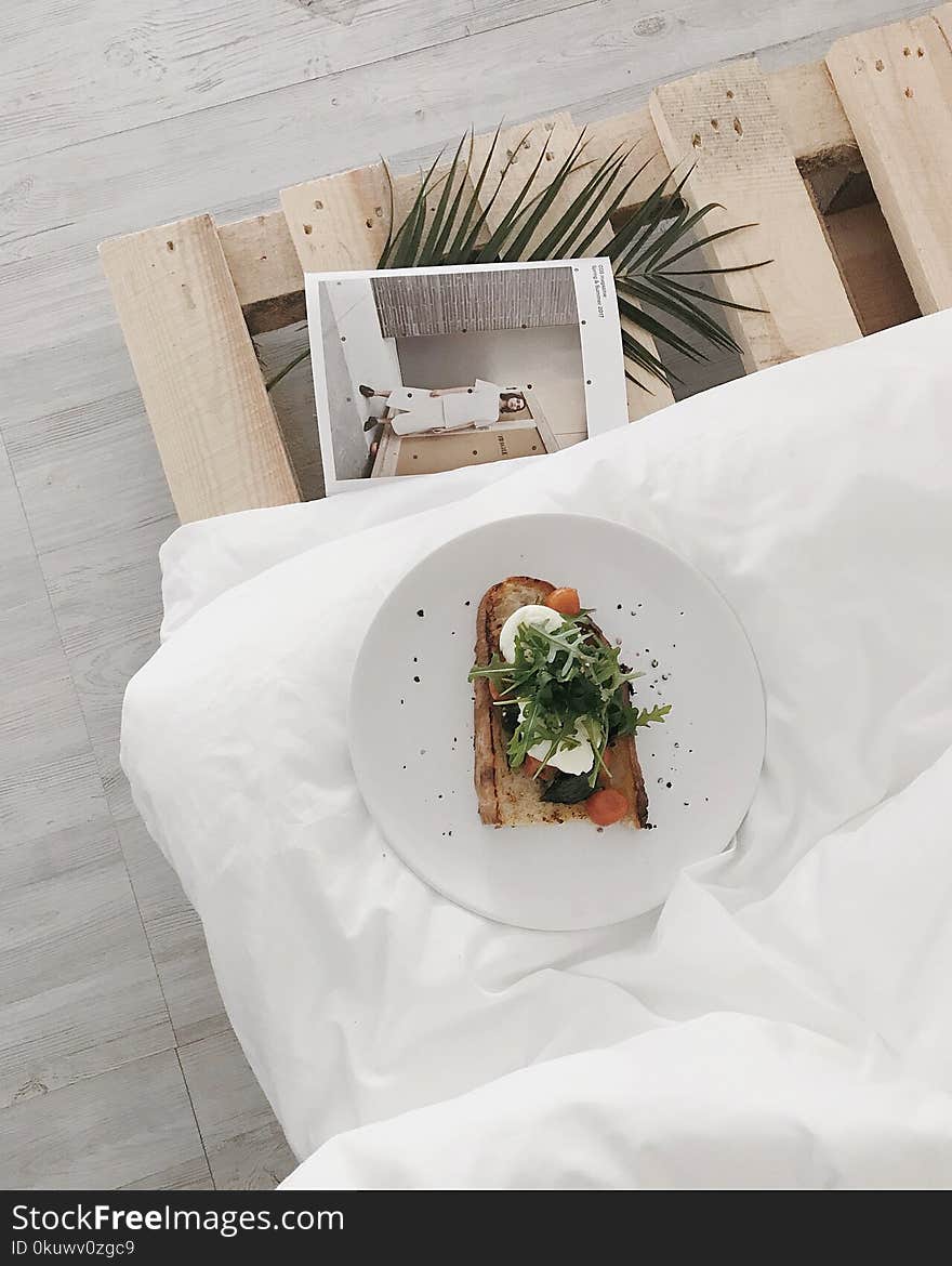 White Ceramic Plate on White Textile