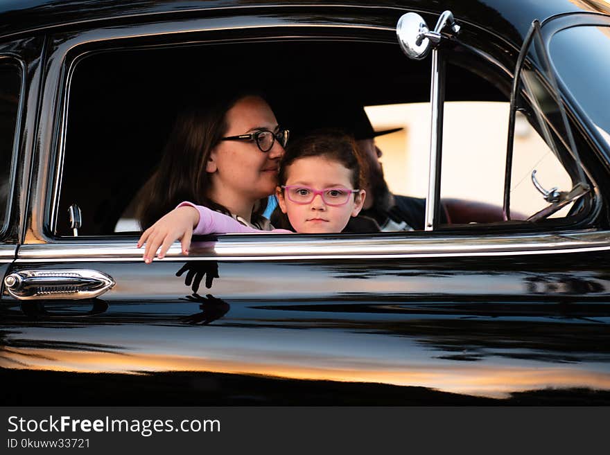 Woman and Child Inside Car