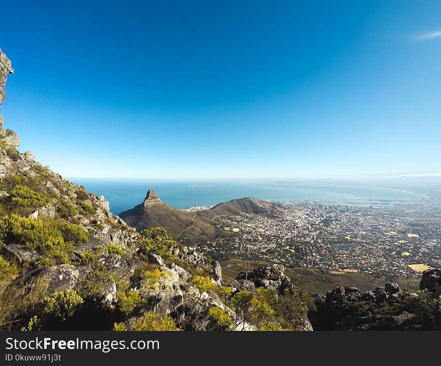 Photo of Mountains and City