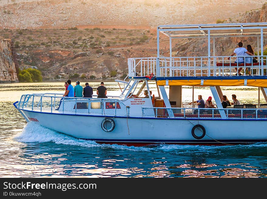 Photo of People Riding on Boat