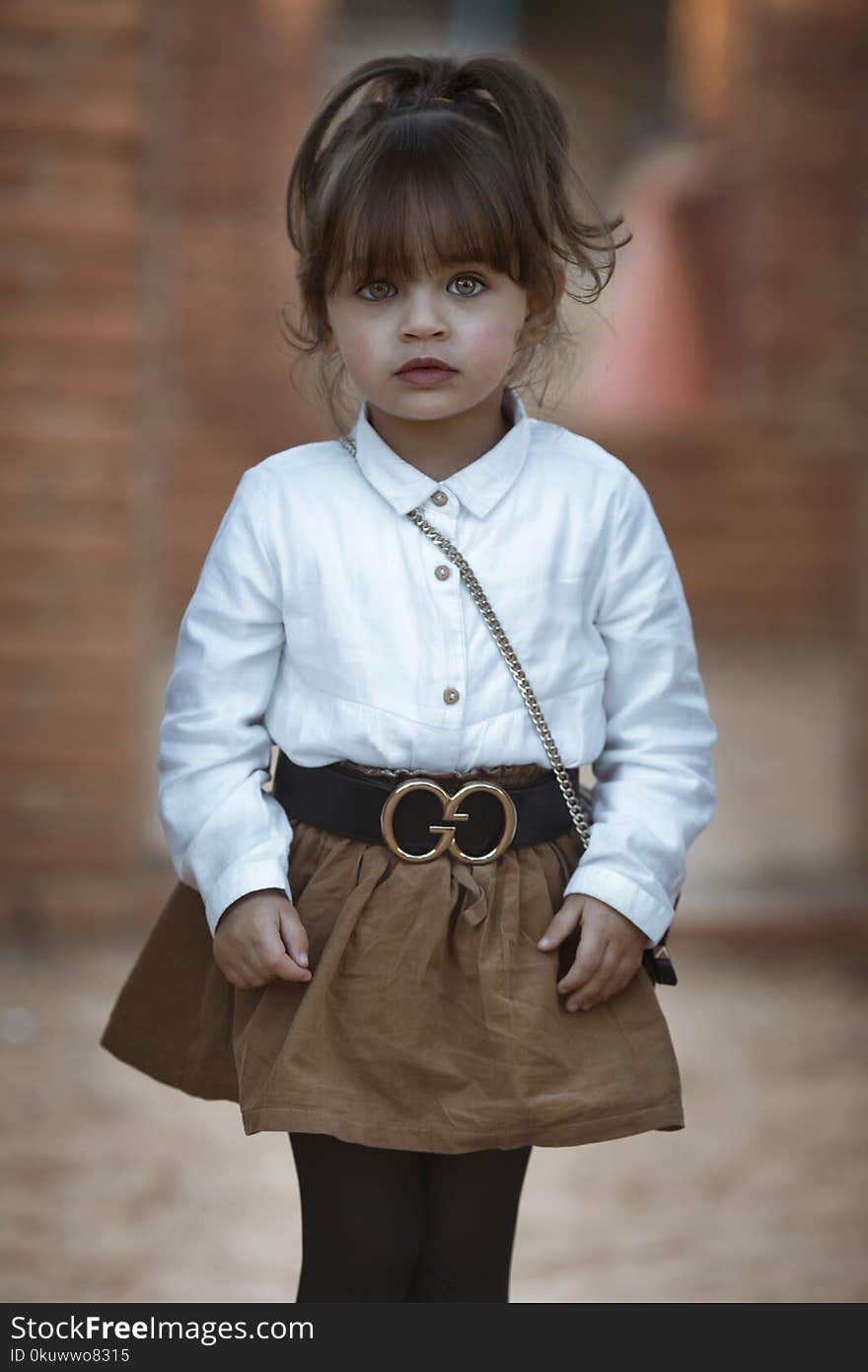 Girl Wearing White Dress Shirt and Brown Skirt