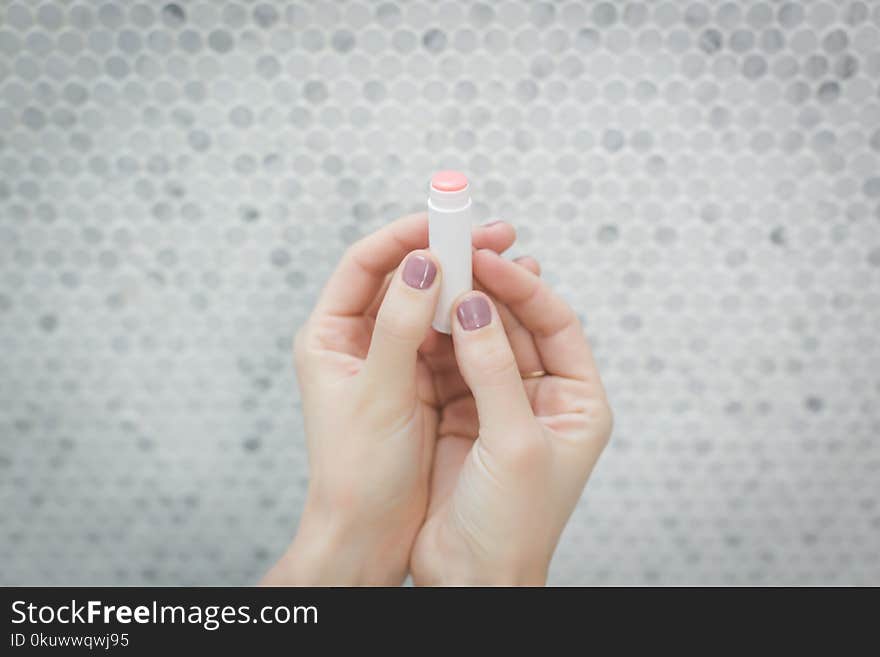 Person Holding a lip balm