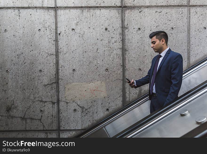 Man Looking at His Phone