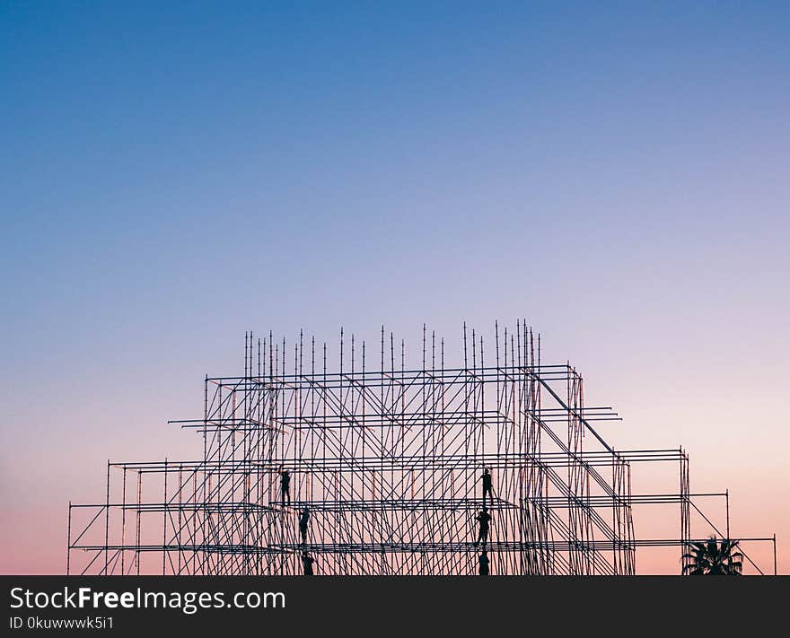 Photo of People on Building Under Construction