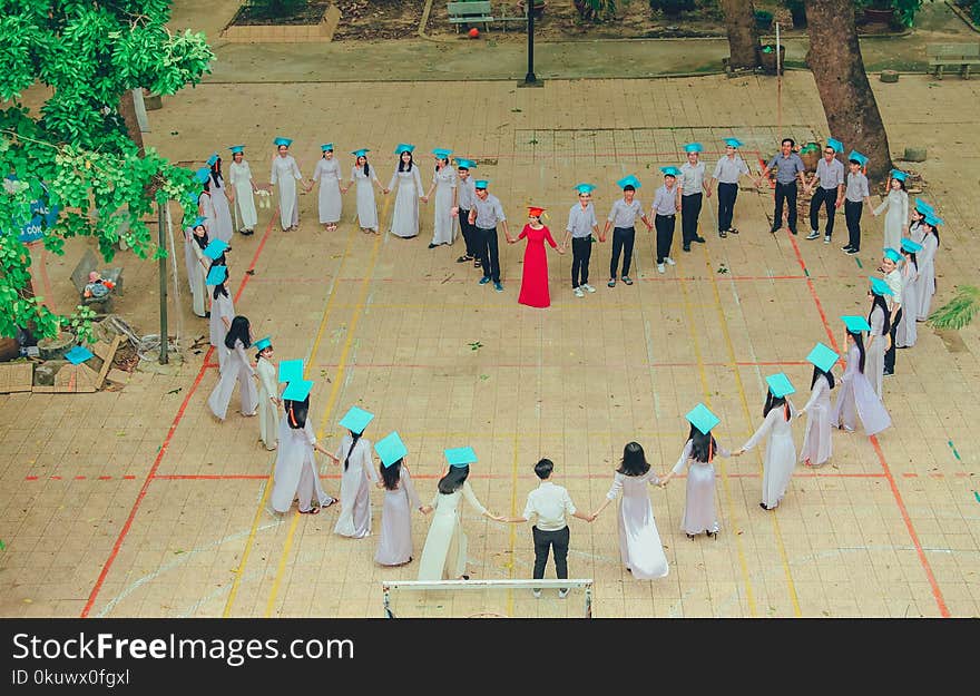 Photography of Group of People Form Heart-shape