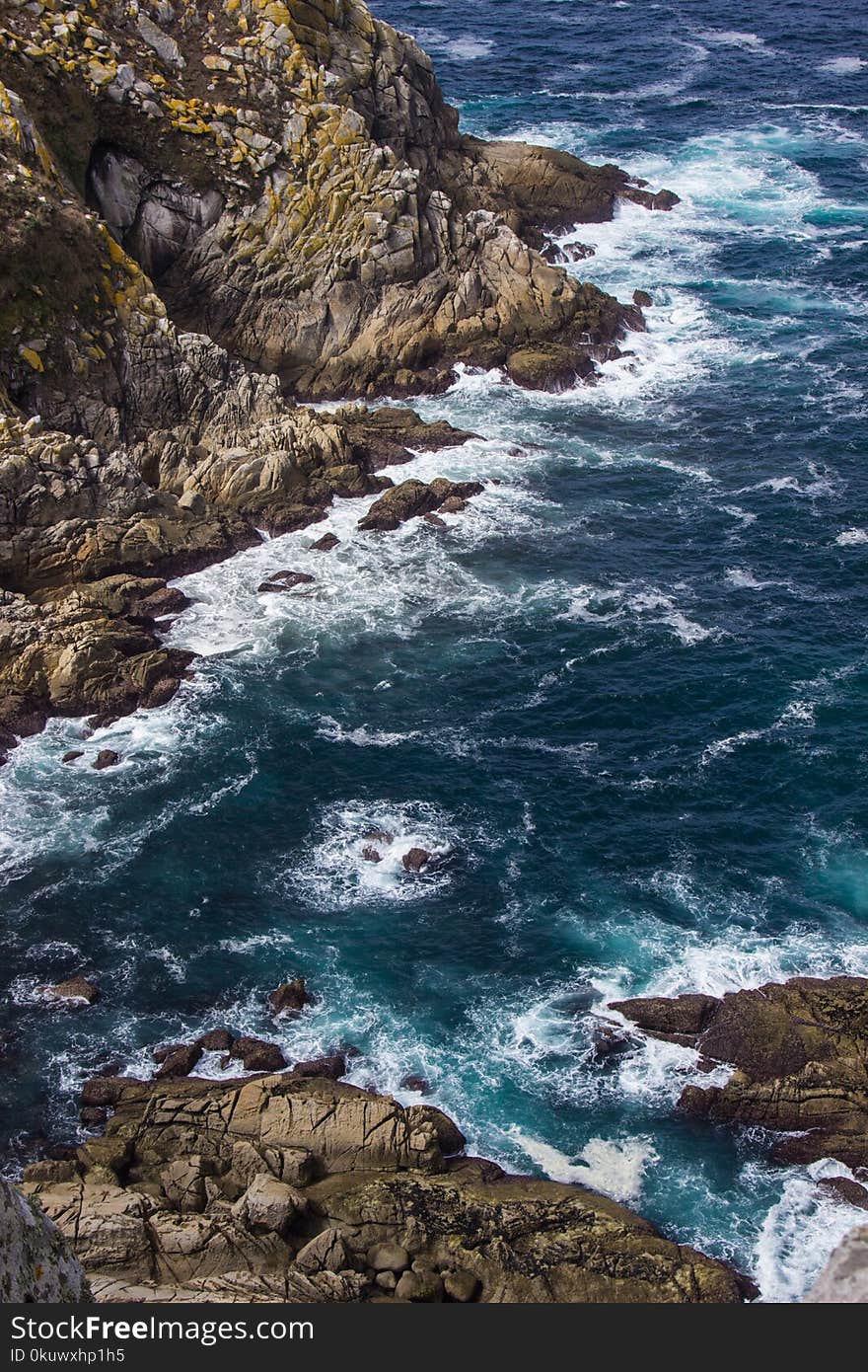 Photo of Wave of Water on Stone